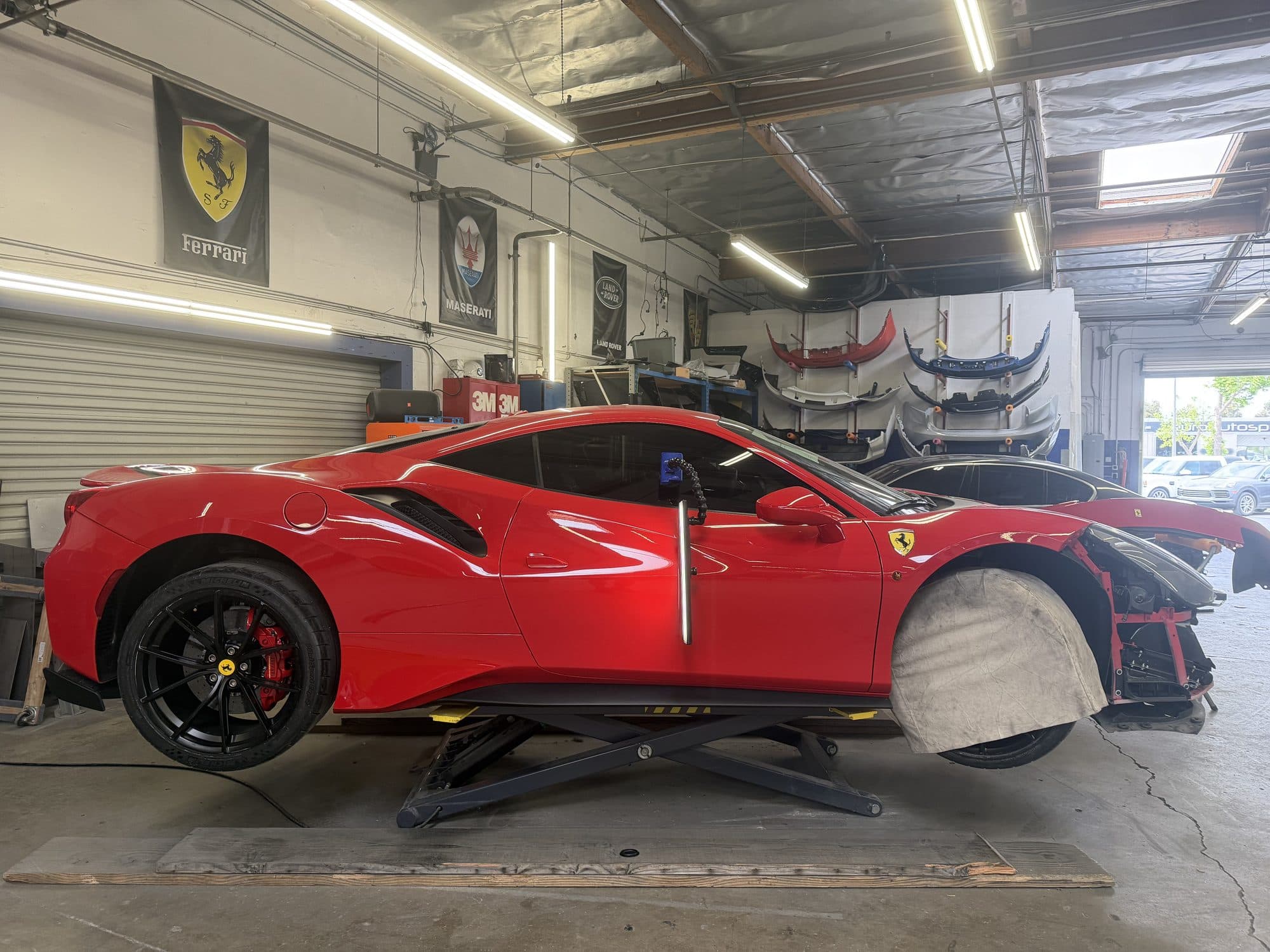 Ferrari 488 on a lift in the Dentology SD shop